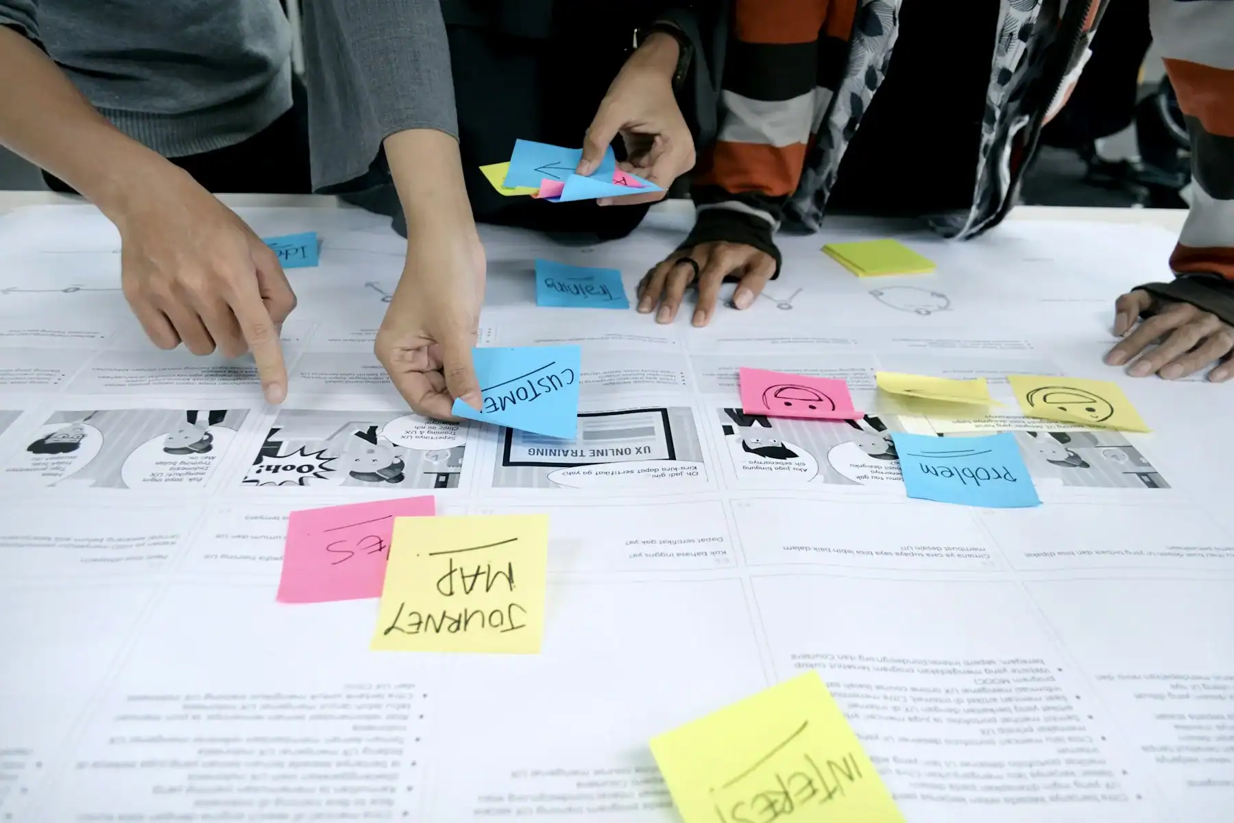 People collaborating with notes on a shared planning wall
