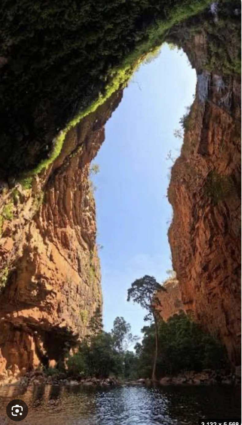 A waterway between towering red rock walls